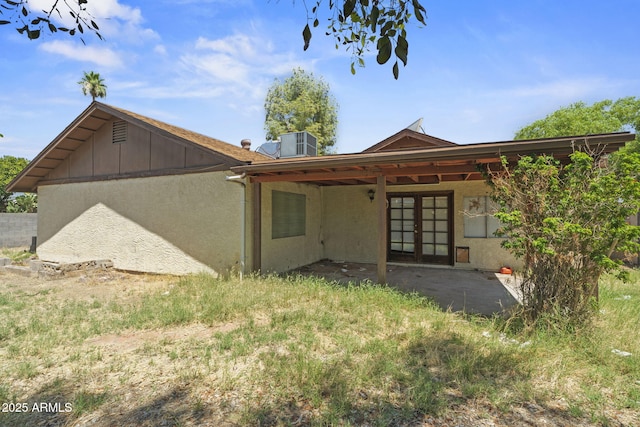 6015 W Acoma Dr, Glendale, AZ 85306 - back of house with french doors, a patio, and stucco siding