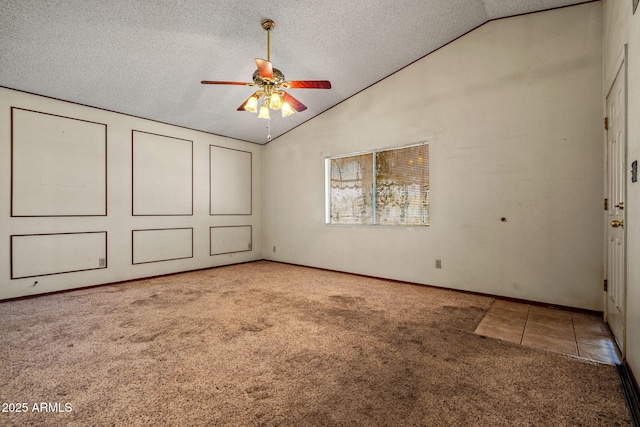 6015 W Acoma Dr, Glendale, AZ 85306 - unfurnished bedroom with lofted ceiling, carpet flooring, a textured ceiling, and tile patterned floors