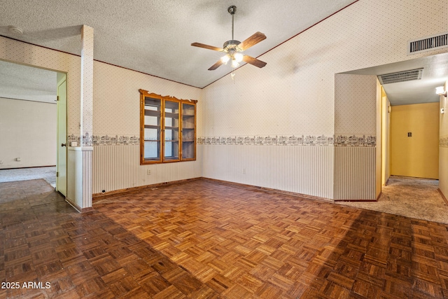 6015 W Acoma Dr, Glendale, AZ 85306 - unfurnished room featuring ceiling fan, a textured ceiling, wallpapered walls, and vaulted ceiling