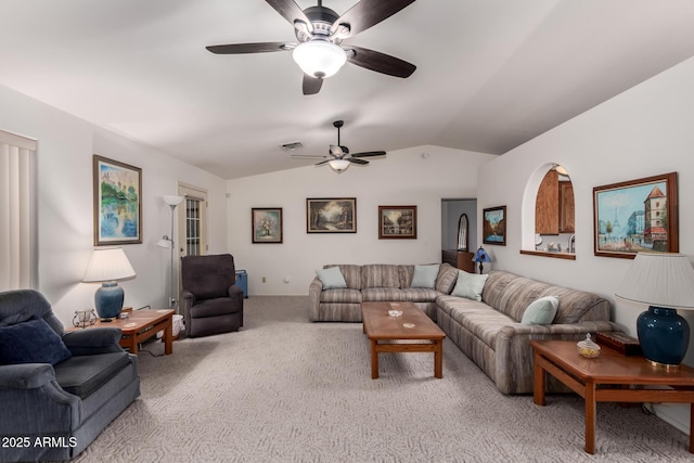 carpeted living room with lofted ceiling and ceiling fan