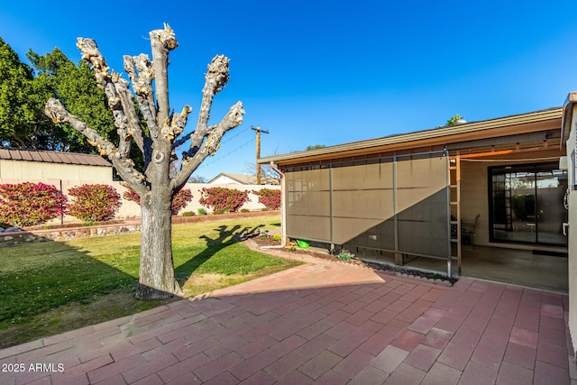 view of home's exterior featuring a yard and a patio