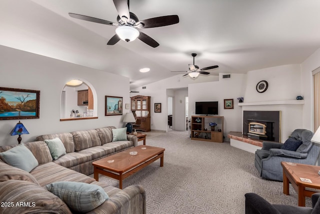 living room featuring lofted ceiling, carpet flooring, and ceiling fan