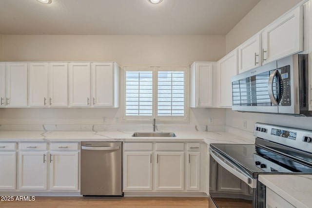 125 N 22nd Pl Unit 5, Mesa, AZ 85213 - kitchen with appliances with stainless steel finishes and white cabinets