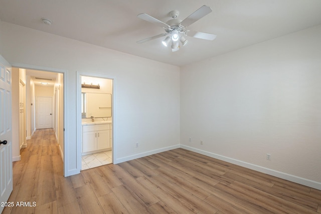 125 N 22nd Pl Unit 5, Mesa, AZ 85213 - unfurnished bedroom with light wood-style flooring, ensuite bath, and a ceiling fan