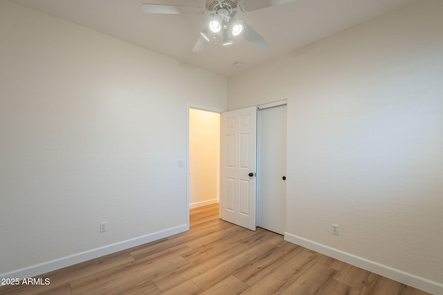 125 N 22nd Pl Unit 5, Mesa, AZ 85213 - unfurnished bedroom with light wood finished floors, a closet, and a ceiling fan