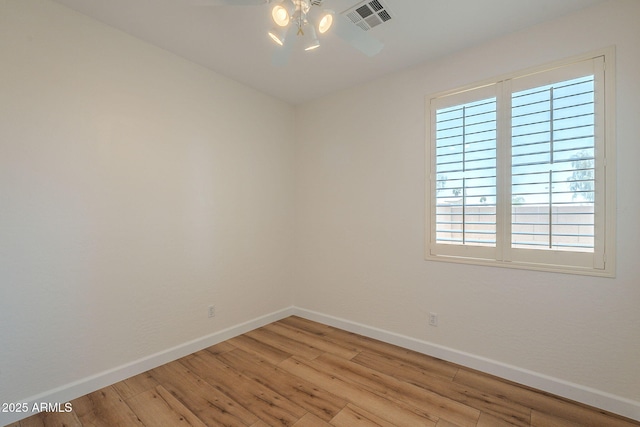125 N 22nd Pl Unit 5, Mesa, AZ 85213 - empty room with light wood-style flooring and plenty of natural light