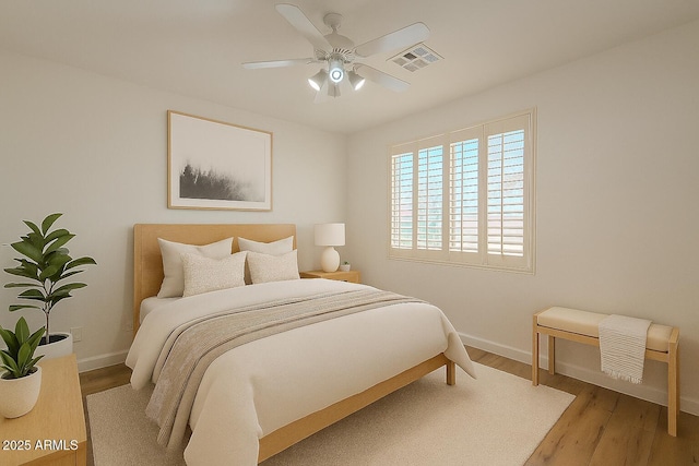 125 N 22nd Pl Unit 5, Mesa, AZ 85213 - bedroom with wood finished floors and a ceiling fan