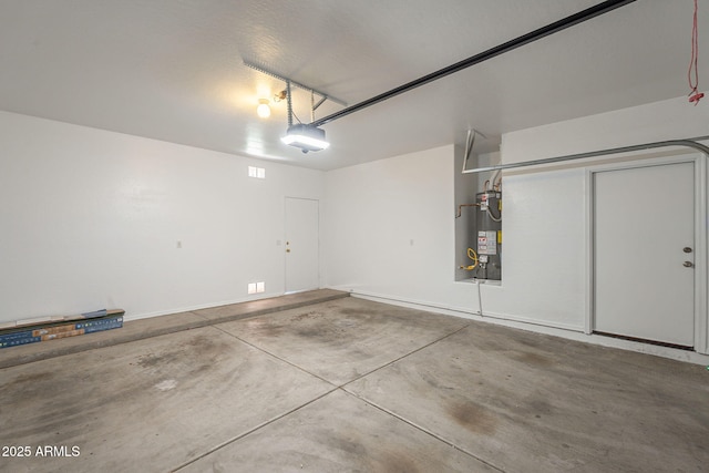 125 N 22nd Pl Unit 5, Mesa, AZ 85213 - garage with secured water heater and a garage door opener