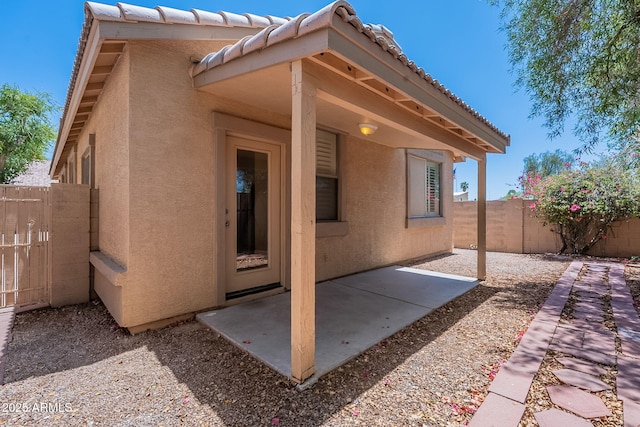 125 N 22nd Pl Unit 5, Mesa, AZ 85213 - rear view of property with a patio area, a fenced backyard, stucco siding, and a tiled roof