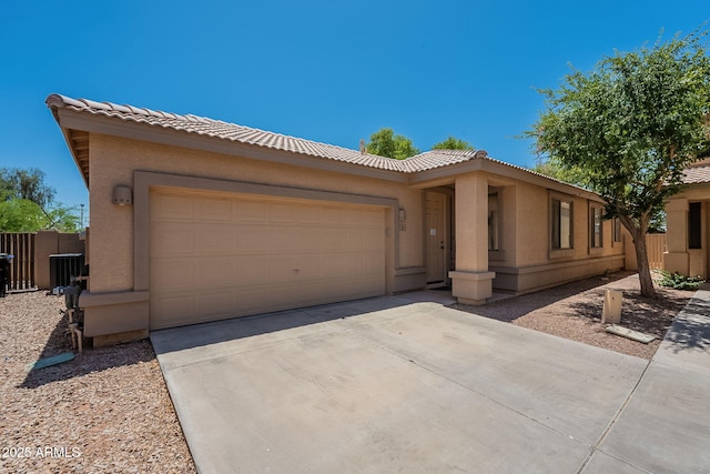 125 N 22nd Pl Unit 5, Mesa, AZ 85213 - view of front facade with a tile roof, an attached garage, stucco siding, and concrete driveway
