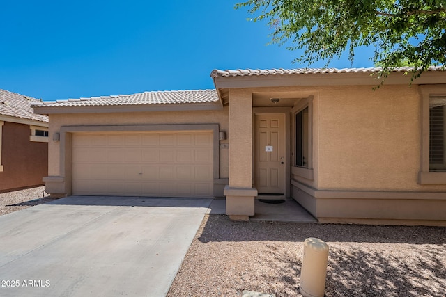125 N 22nd Pl Unit 5, Mesa, AZ 85213 - view of front of house featuring a garage, stucco siding, concrete driveway, and a tile roof