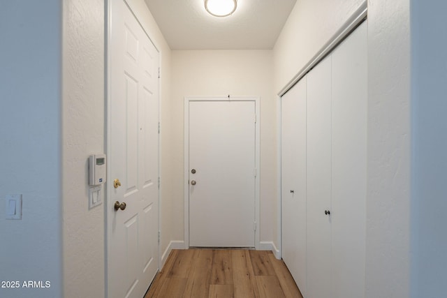 125 N 22nd Pl Unit 5, Mesa, AZ 85213 - entryway featuring light wood-style flooring and baseboards