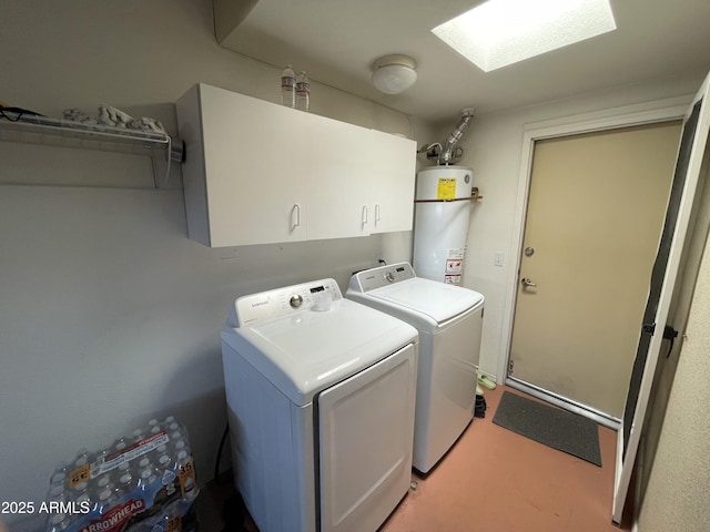 laundry room featuring washer and dryer, cabinets, and water heater