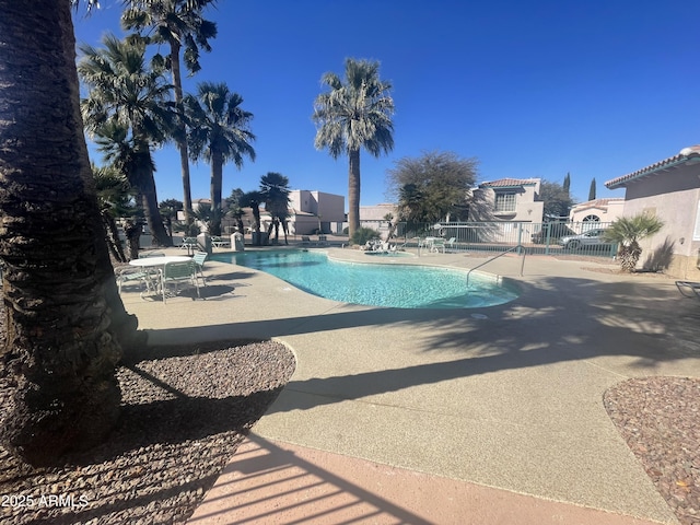 view of swimming pool with a patio