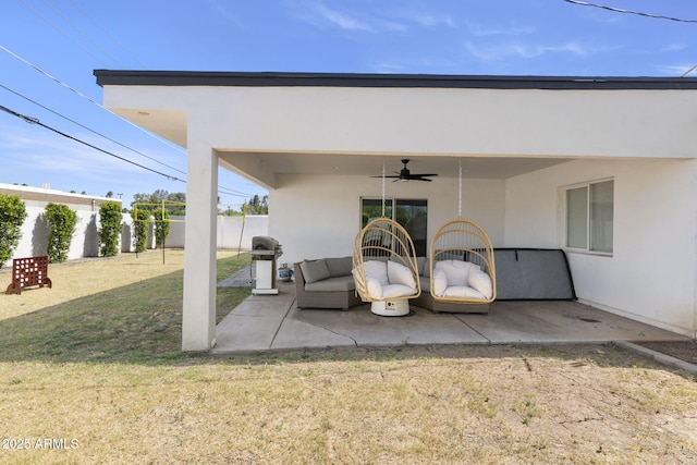 view of patio featuring a grill, ceiling fan, fence, and outdoor lounge area