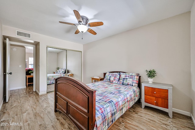 7125 W Canterbury Dr, Peoria, AZ 85345 - bedroom with a closet, light wood-style floors, baseboards, and ceiling fan