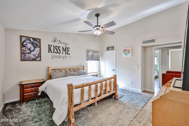 7125 W Canterbury Dr, Peoria, AZ 85345 - bedroom with vaulted ceiling, wood finished floors, baseboards, and a ceiling fan