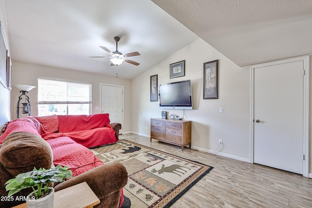 7125 W Canterbury Dr, Peoria, AZ 85345 - living room with lofted ceiling, ceiling fan, baseboards, and light wood finished floors