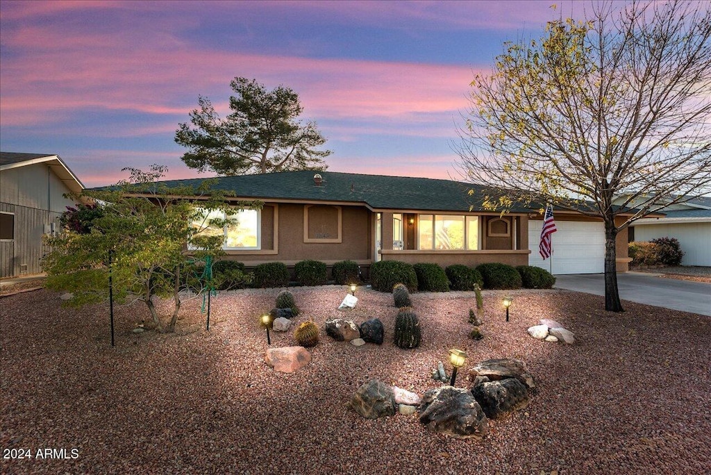 single story home with a garage