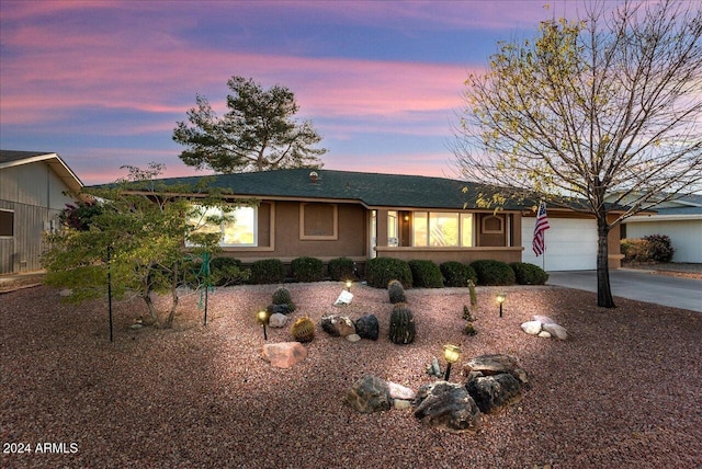 single story home with a garage