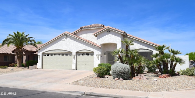 520 E Appaloosa Rd, Gilbert, AZ 85296 - mediterranean / spanish house with concrete driveway, a tiled roof, stucco siding, and a garage
