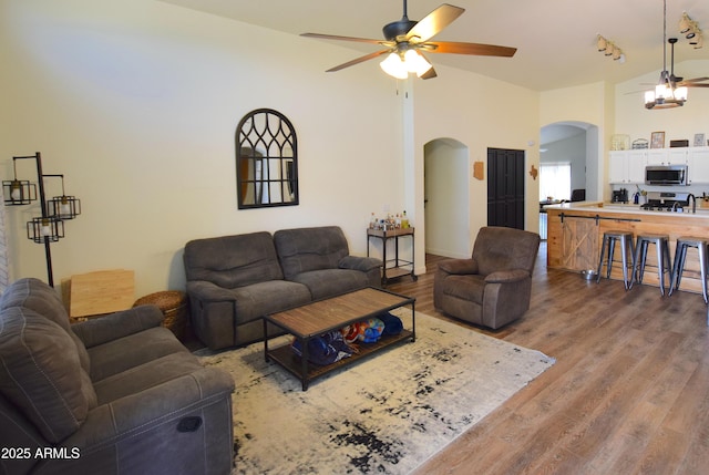 520 E Appaloosa Rd, Gilbert, AZ 85296 - living area with arched walkways, ceiling fan, and wood finished floors