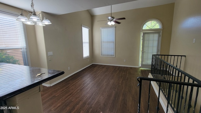 5628 S 21st Pl, Phoenix, AZ 85040 - unfurnished dining area featuring dark wood-type flooring, baseboards, lofted ceiling, a chandelier, and a ceiling fan