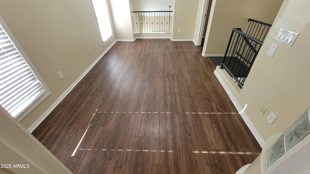 5628 S 21st Pl, Phoenix, AZ 85040 - unfurnished living room featuring wood finished floors and baseboards