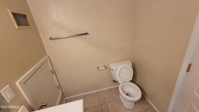 5628 S 21st Pl, Phoenix, AZ 85040 - bathroom with tile patterned floors, baseboards, and toilet
