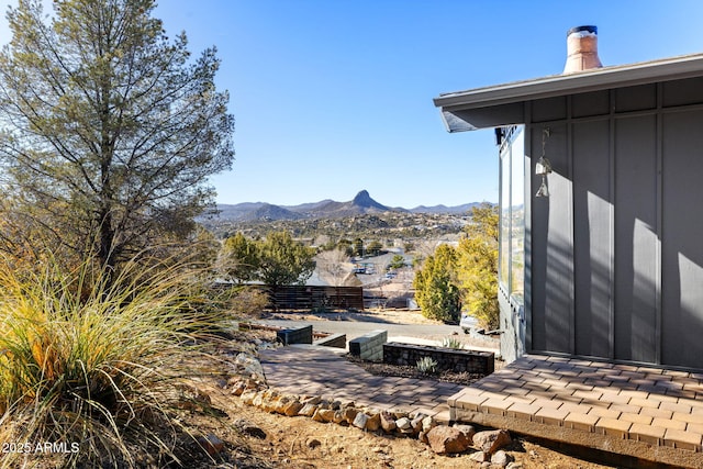 view of yard featuring a patio area and a mountain view