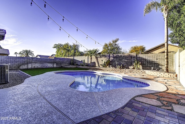 view of swimming pool with a fenced in pool, cooling unit, a fenced backyard, and a patio