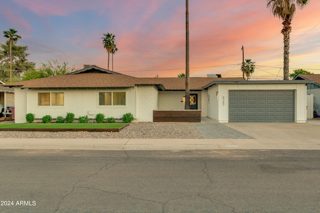 single story home with a garage