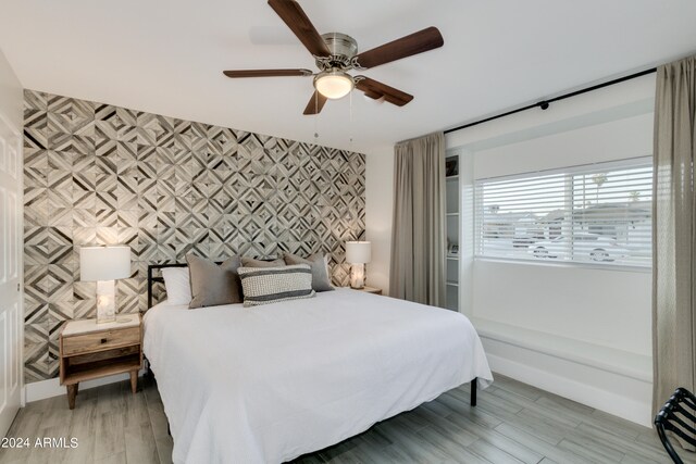 bedroom featuring ceiling fan and hardwood / wood-style flooring