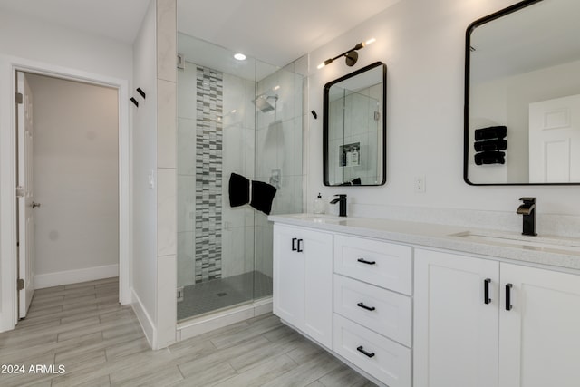 bathroom with vanity and walk in shower