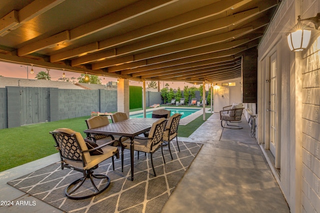 view of patio with a fenced in pool