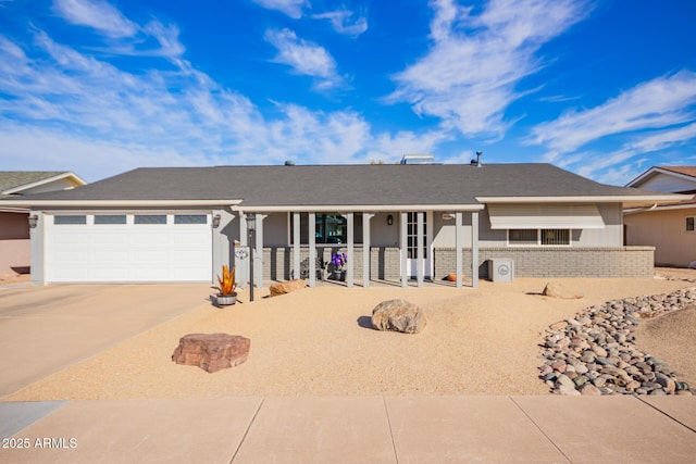 ranch-style house featuring a garage