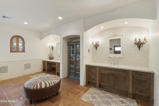 bathroom with tile patterned flooring and vanity