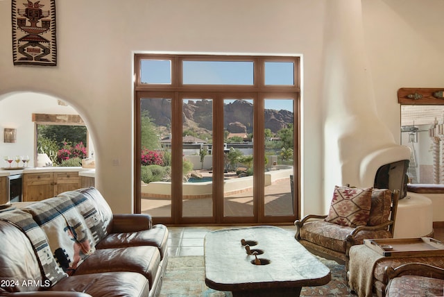 living room with a healthy amount of sunlight and a mountain view