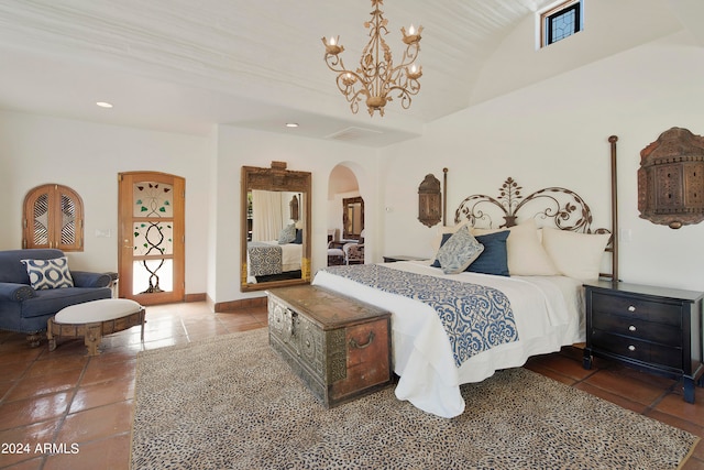 bedroom featuring tile patterned floors and a chandelier