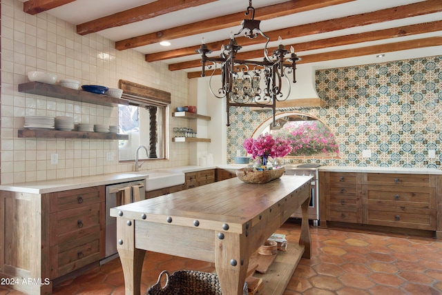 kitchen featuring tasteful backsplash, appliances with stainless steel finishes, sink, and a wealth of natural light