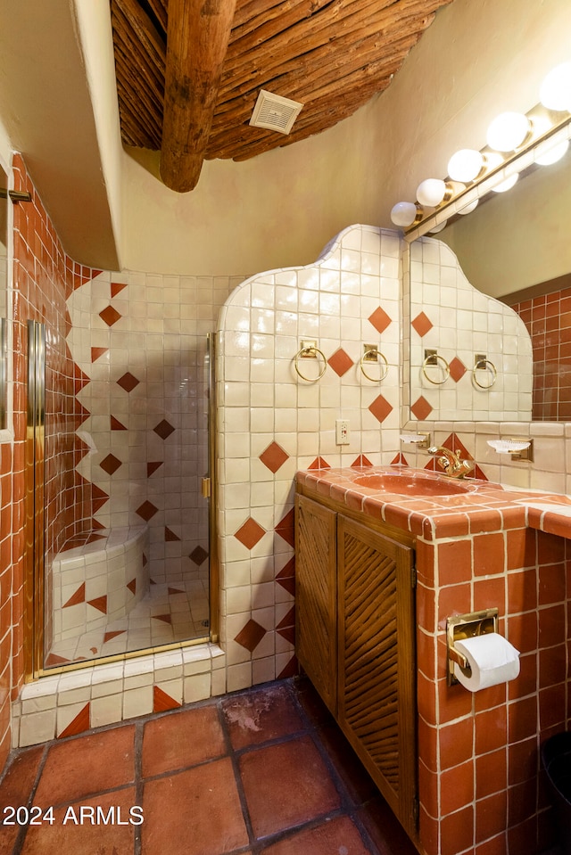 bathroom featuring beamed ceiling, tile walls, vanity, an enclosed shower, and wood ceiling