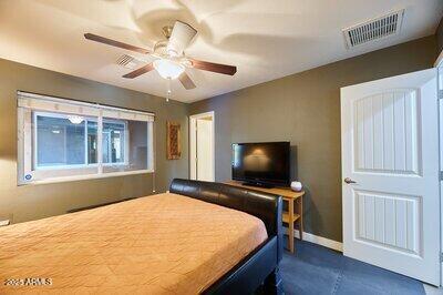 bedroom featuring ceiling fan