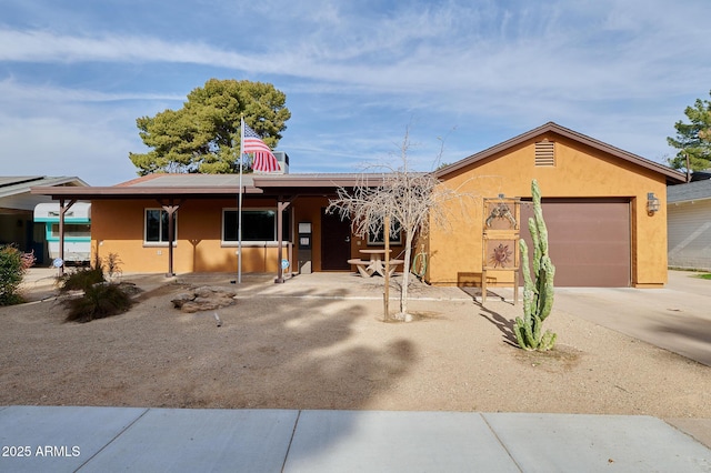 single story home featuring a garage