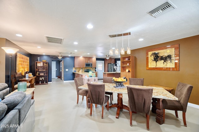 dining space featuring ceiling fan