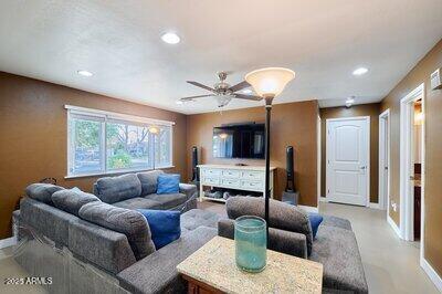 living room with ceiling fan