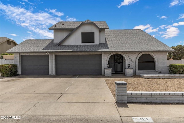 6237 W Altadena Ave, Glendale, AZ 85304 - view of front of property with concrete driveway, a shingled roof, an attached garage, and brick siding