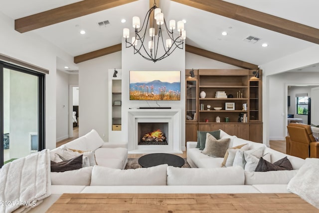 living room with lofted ceiling with beams, built in shelves, and wood-type flooring