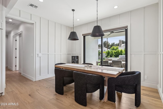 dining area featuring light wood-type flooring