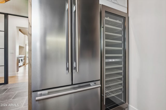 interior details with beverage cooler and high end refrigerator