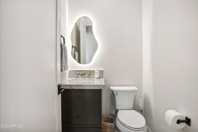 bathroom with toilet and vanity